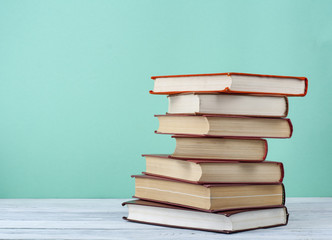 Stack of books on wooden table. Education background.Back to school. Copy spase for text.