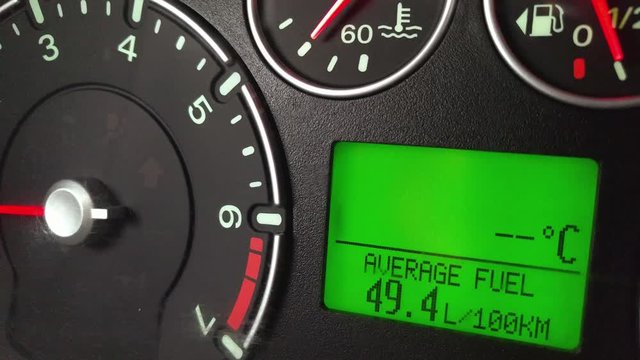 Close up footage of a car's dashboard indicating a very high fuel consumption.