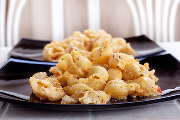 pasta on a dark plate on the dining table