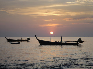 Thai longtail boat at sunset