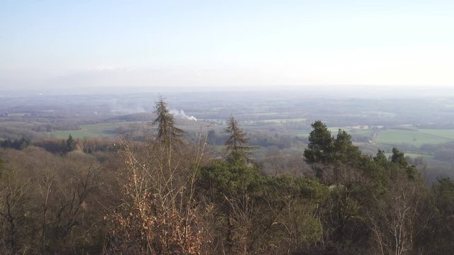 English Countryside near London. Early spring beech wood. Copy space background. Beautiful views of the valley.