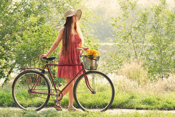 Young woman and bike