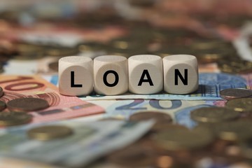 loan - cube with letters, money sector terms - sign with wooden cubes