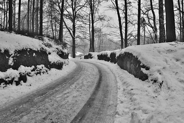 snowy way leading to village Karba in Machuv kraj during winter Czech - obrazy, fototapety, plakaty