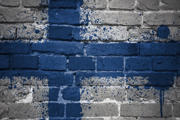 painted national flag of finland on a brick wall