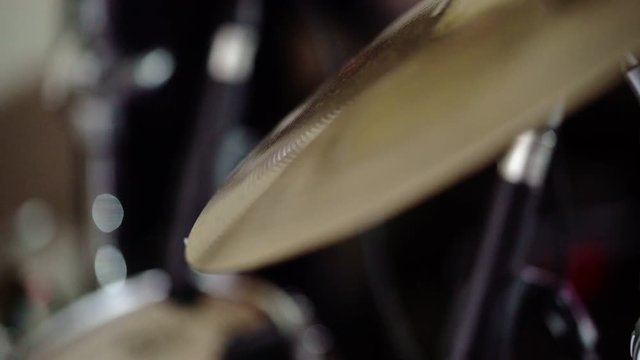 Drummer playing plates on concert close up shot
