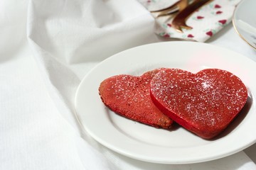 Heart shaped red velvet pancakes / Valentine breakfast concept, selective focus