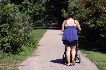 Fototapeta premium Motherly Stroll In The Park