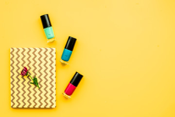 decorative cosmetics on yellow background top view