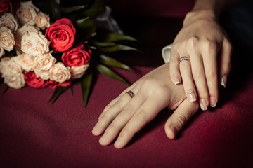 Obraz na płótnie Canvas wedding theme, man and woman holding hands with a nice manicure neat