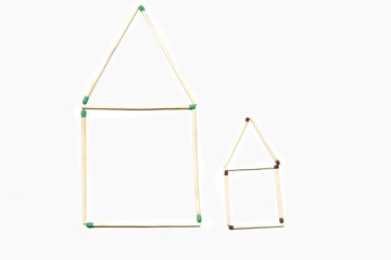 Big and small house made of matches.