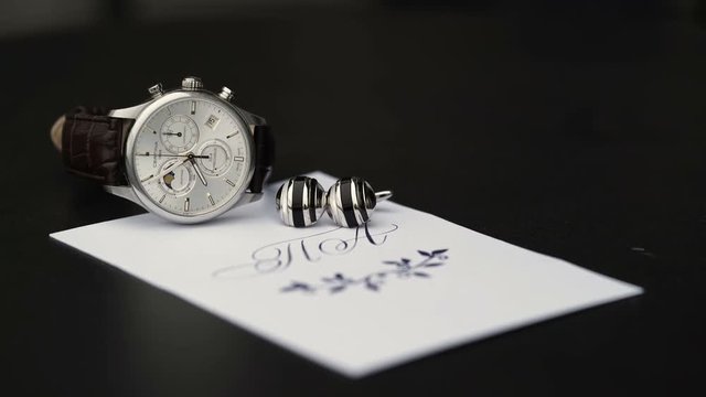 Wrist watch and cufflink timelapse shot