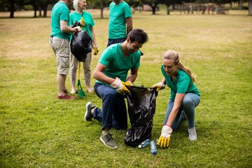 Team of volunteers picking up litter