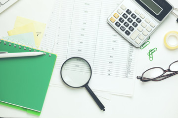 keyboard,notebook and stationary on table