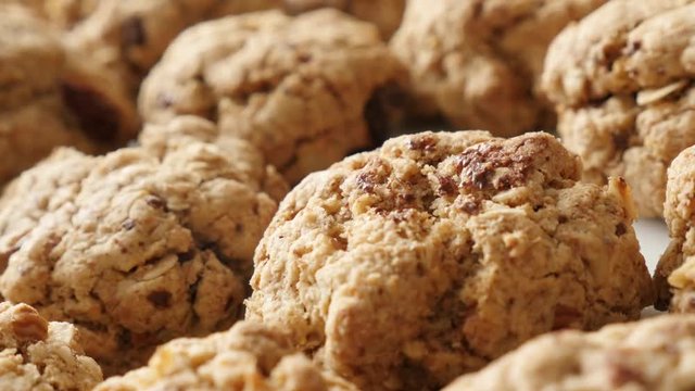 Homemade fresh chocolate chip cookies close-up slow pan 4K 2160p 30fps UHD footage - Oatmeal biscuits pile served on plate shallow DOF 3840X2160 UltraHD panning video