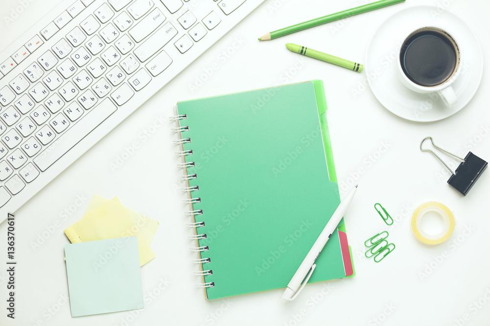 Poster keyboard,notebook and stationary on table