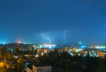 power lightning in the evening at town