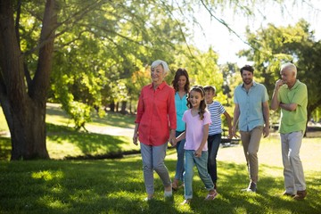 Fototapeta premium Happy family enjoying in park