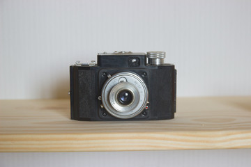 Old photo camera objective with low depth of field