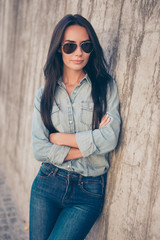 Happy smiling young woman in glasses with crossed hands