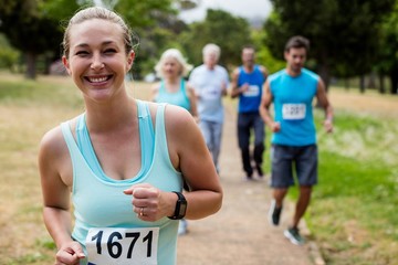 Athletes running race in park