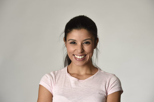 portrait of young beautiful and happy Latin woman with big toothy smile excited and cheerful