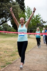 Athletes running race in park