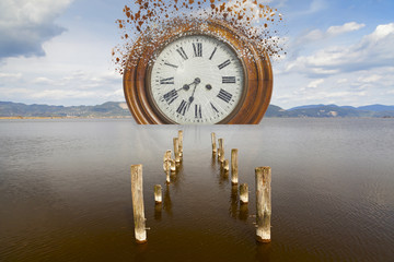 surreal broken clock in the sea