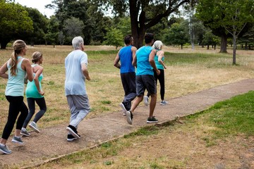 Fototapeta premium Athletes running race in park