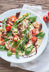 Crepes with cherry tomatoes, cheese, mushrooms and arugula