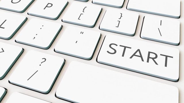 Close-up dolly shot of white computer keyboard and start key. Conceptual 4K clip