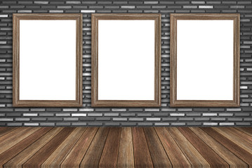 picture frame with wooden table over brick wall