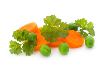 Carrot slice, green peas, isolated on white.