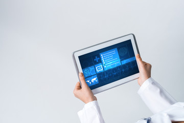 Close of female doctor hands working with tablet pc computer