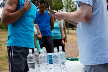 Volunteer registering athletes name for race