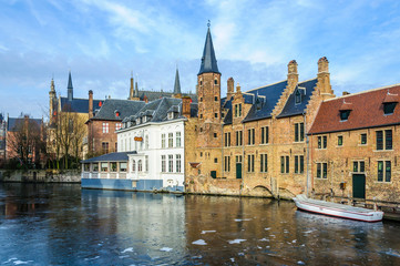 Scenery with frozen water canal in Bruges, Belgium