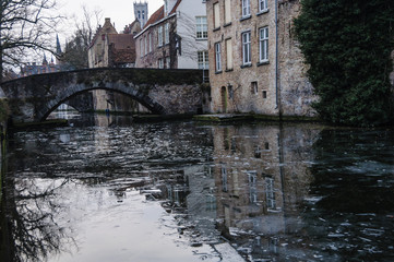 Fototapeta na wymiar Reflections in the canal in Bruges, Belgium