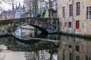 Reflections in the canal in Bruges, Belgium