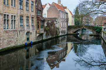 Naklejka premium Reflections in the canal in Bruges, Belgium