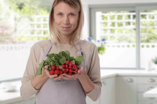 Portrait of happy Woman holding fresh organic Vegetables radishes, cooking, healthy eating, dieting concept