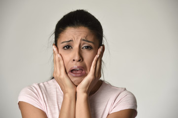 Mexican sad woman serious and concerned crying desperate overacting on feeling depressed