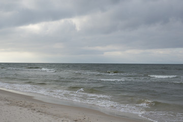 beach by the sea on a cloudy day