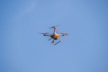 The drone, hovering in the sky. Flight quadrocopters