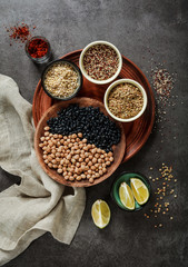 Composition of various kinds of legumes on black background