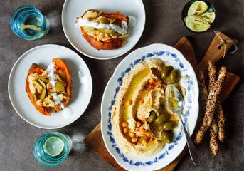 Healthy Homemade Creamy Hummus with Olive Oil  and breadsticks w