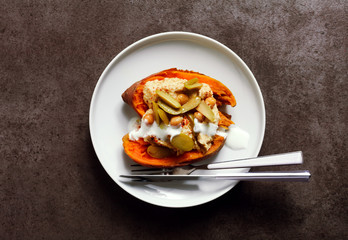 a dish of Sweet potato, baked in the oven, and Hummus with green