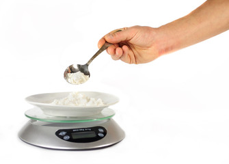 Hand poured flour weighing electronic kitchen scales