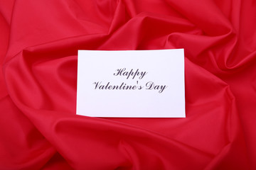 Valentines day gift box on red background. Holidays card with copy space.