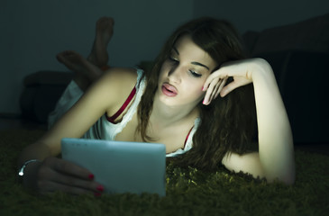 Obraz premium Girl with a tablet