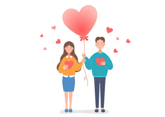 The couple are holding a heart balloon.